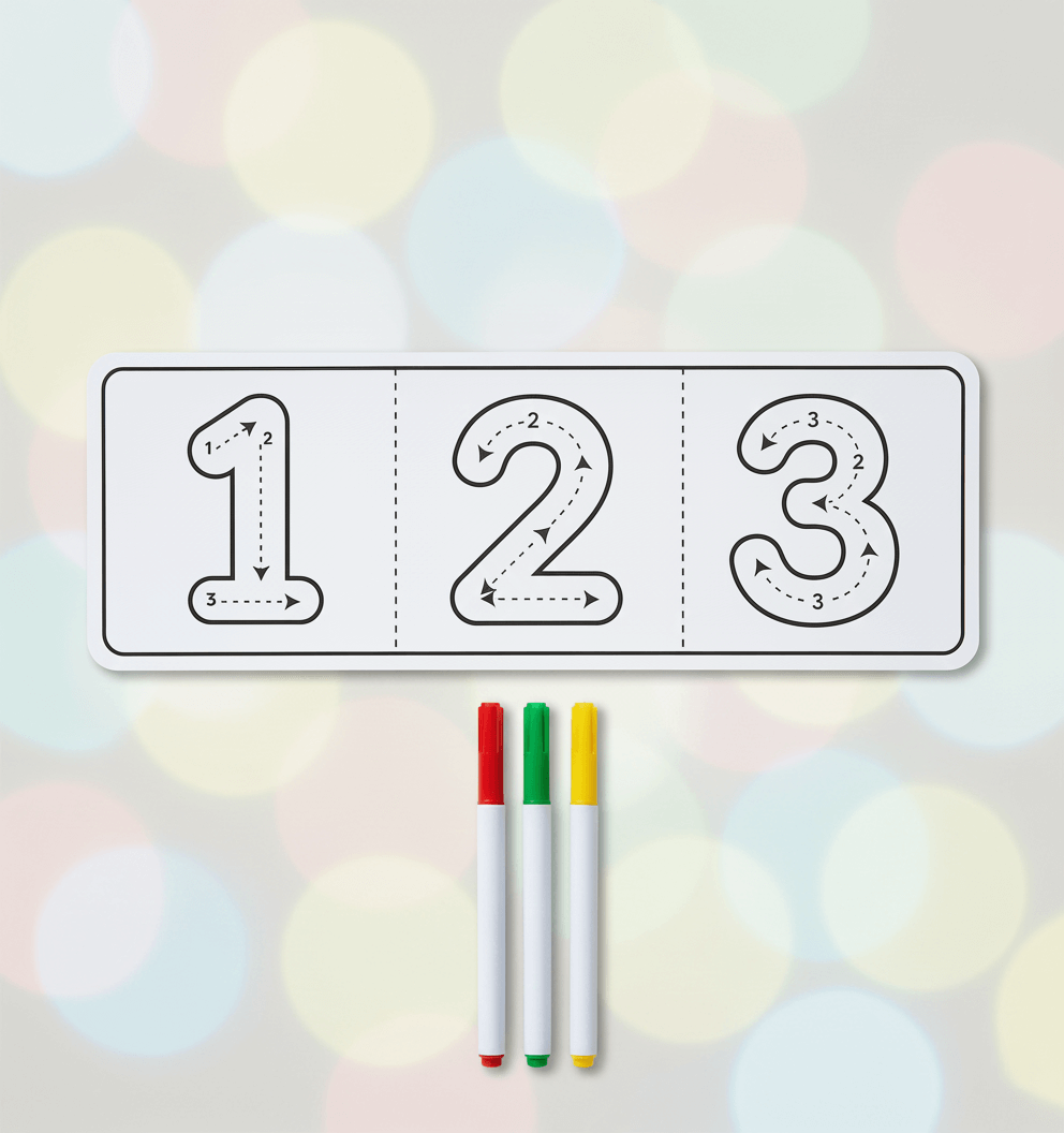 Tracing sheet with numbers 1, 2, 3 and three markers on a blurred background